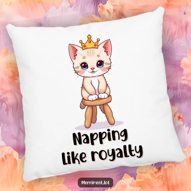 Funny pillow illustration of a playful kitten in a tiny crown balancing on a wobbly stool, offering plush comfort and adorable humor.