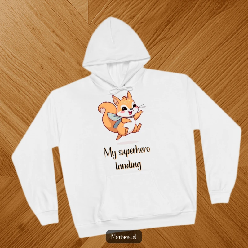 Funny hoodie featuring a playful squirrel wearing a sparkly cape, leaping joyfully for cozy adventures.
