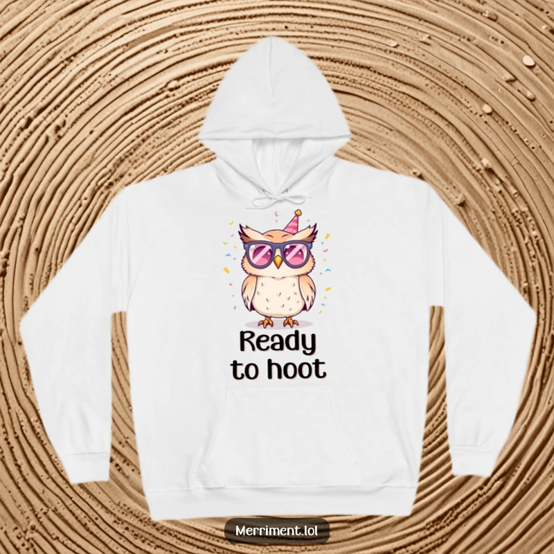 Funny hoodie with a mischievous owl wearing flashy party glasses and showering confetti, perfect for festive gatherings and cozy nights.