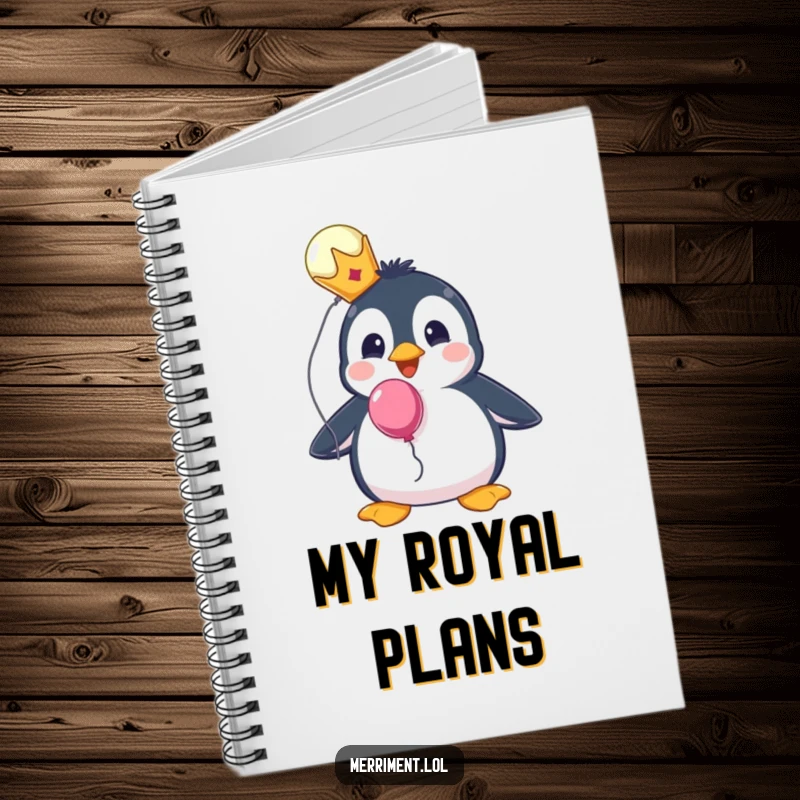 Funny notebook featuring a surprised penguin wearing a tiny crown and holding a balloon, ideal for note-taking.