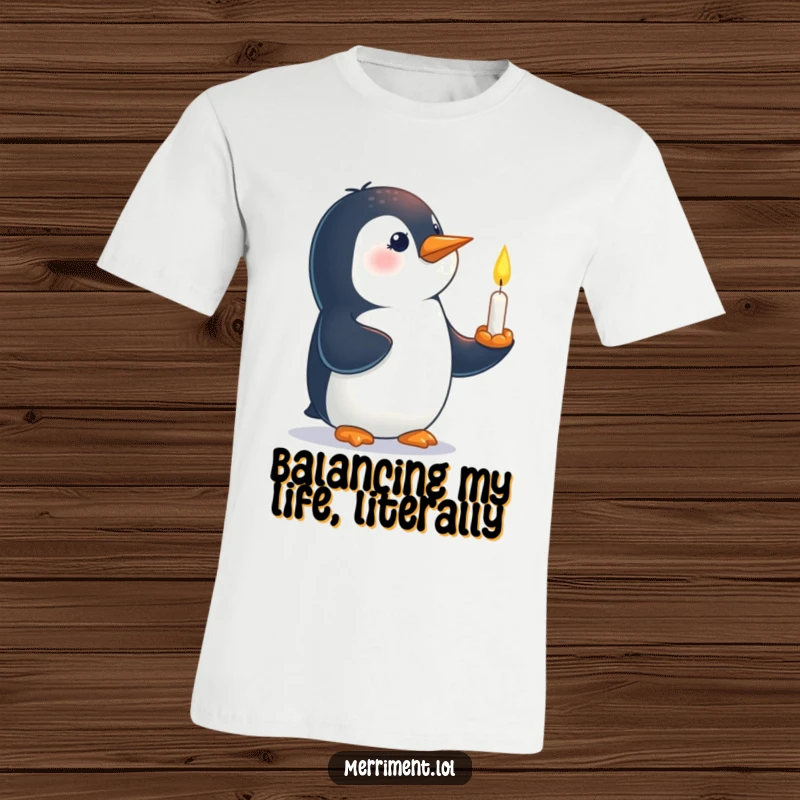 Funny t-shirt depicting a curious penguin balancing a tiny, lit candle on its beak with focus.