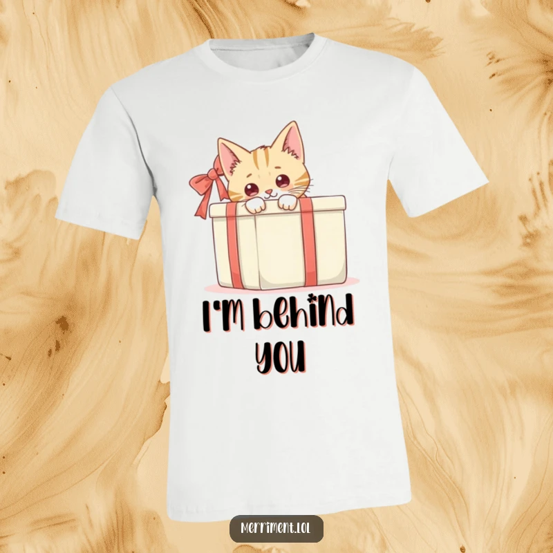 Funny, curious cat peeking from behind a large gift box, a humorous and endearing design for a comfortable t-shirt.