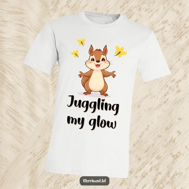 Funny t-shirt featuring a determined squirrel energetically juggling three sparkling fireflies in a display of cheerful multitasking.