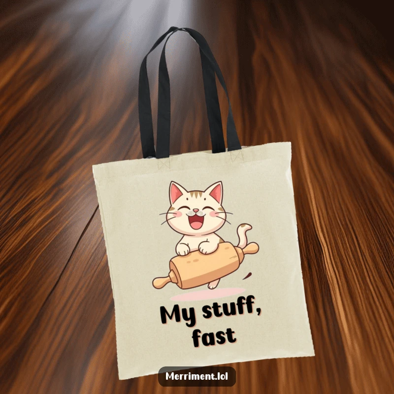 Funny Cat Tote Bag, a cheerful cat with a wide grin, joyfully riding a rolling pin, ready for adventures.